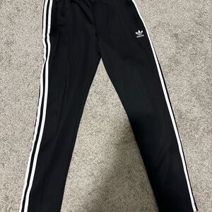 Adidas women’s  Black trainer pants with White Stripes